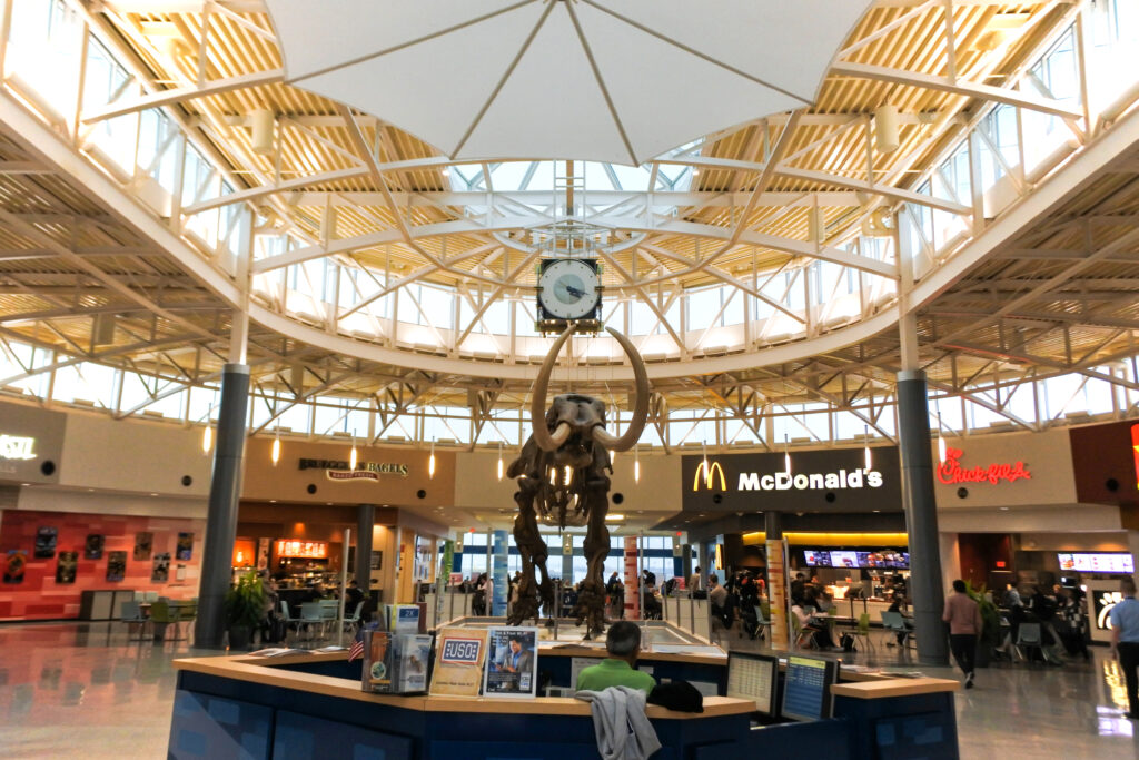 people enjoying food at airport